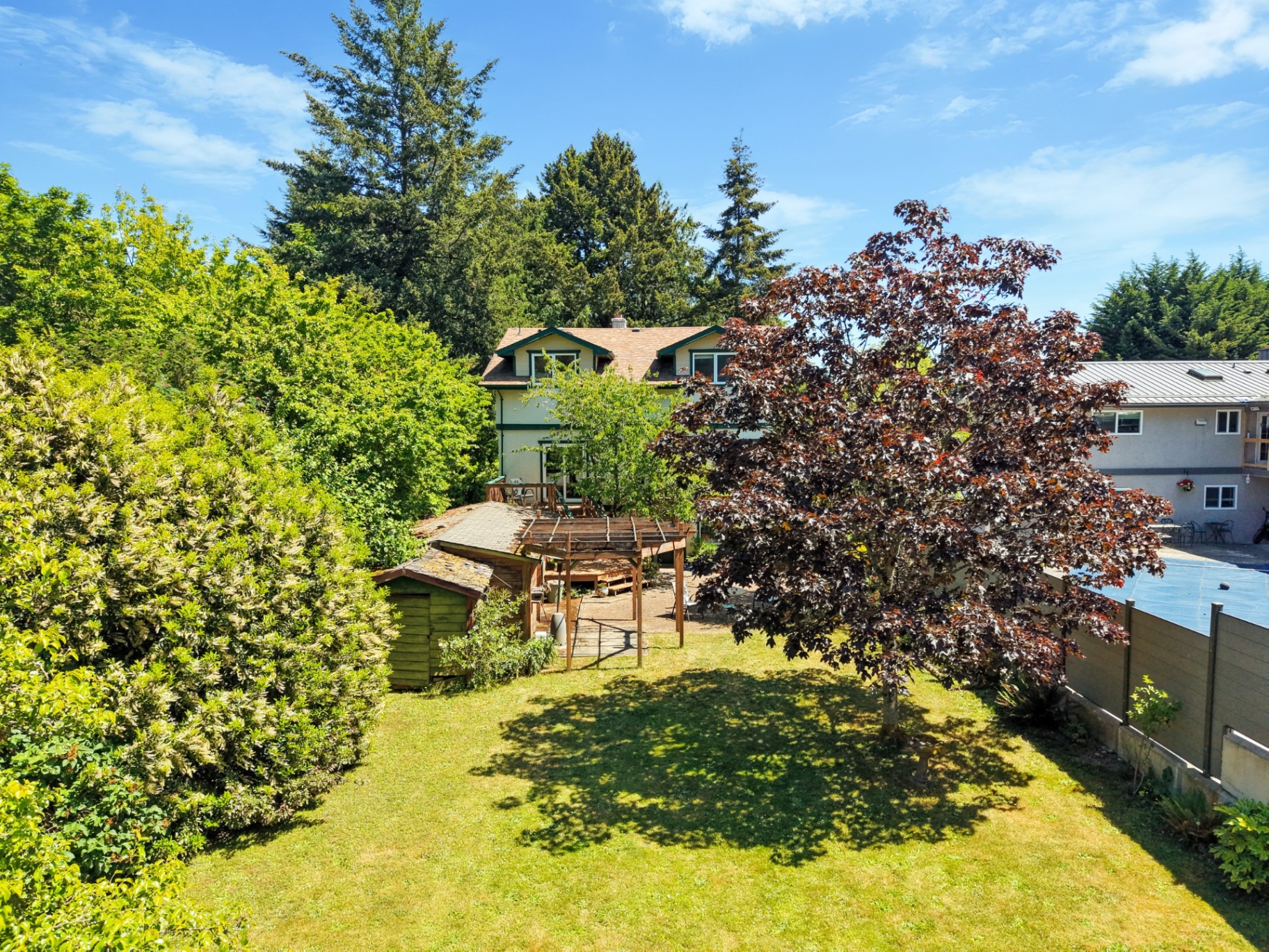 Aerial view of property and backyard